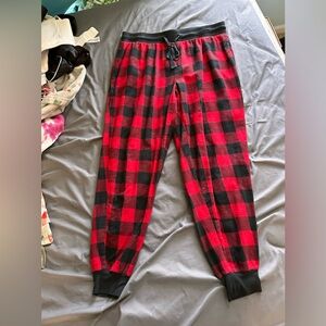 Stars above red and black flannel pajama pants size M